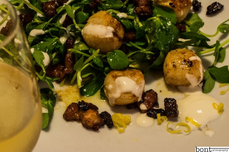 Pan-fried scallops with crisp pancetta, pea shoots & lemon creme fraiche