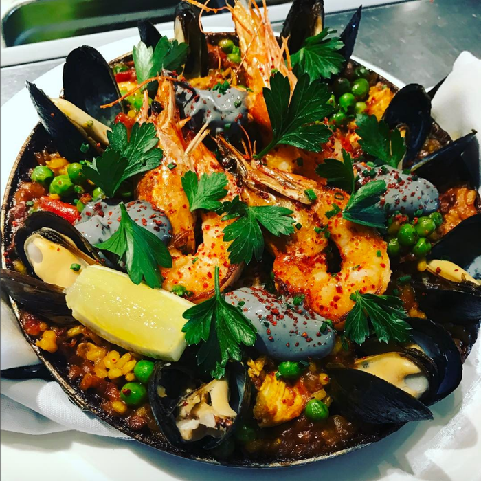  Paella Valenciana: shrimp, mussels, chicken, chorizo, black garlic